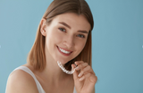 woman smiling after her aligners fixed her crowded teeth
