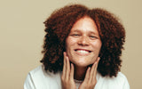 person smiling knowing the differences between aligners and braces and which option is the right choice to straighten teeth