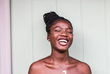 Woman smiling with nighttime aligners