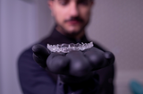 Man holding nighttime aligners