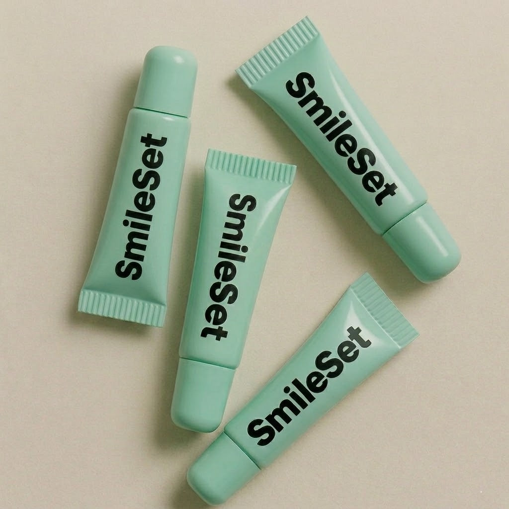 Four mint SmileSet hydrating lip gloss tubes
