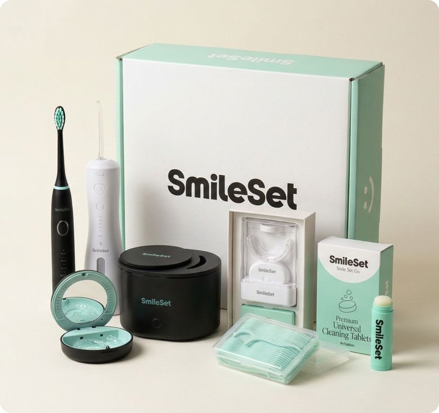 SmileSet Oral Care Bundle box with the sonic toothbrush, water flosser, ultrasonic cleaner, UV travel case, whitening kit, floss picks, cleaning tablets and lip balm