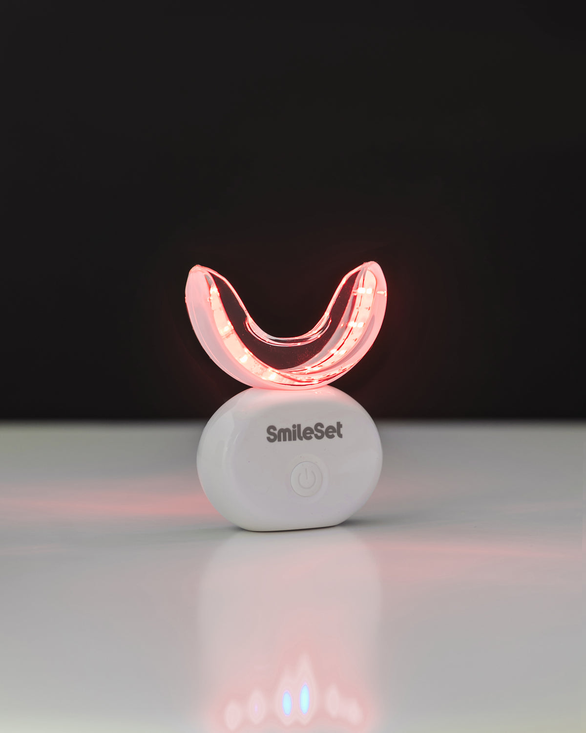 SmileSet LED whitening tray glowing red