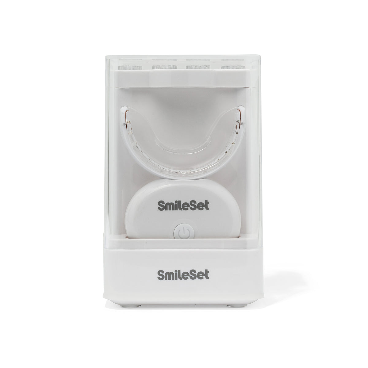 White SmileSet LED whitening tray in its charging stand