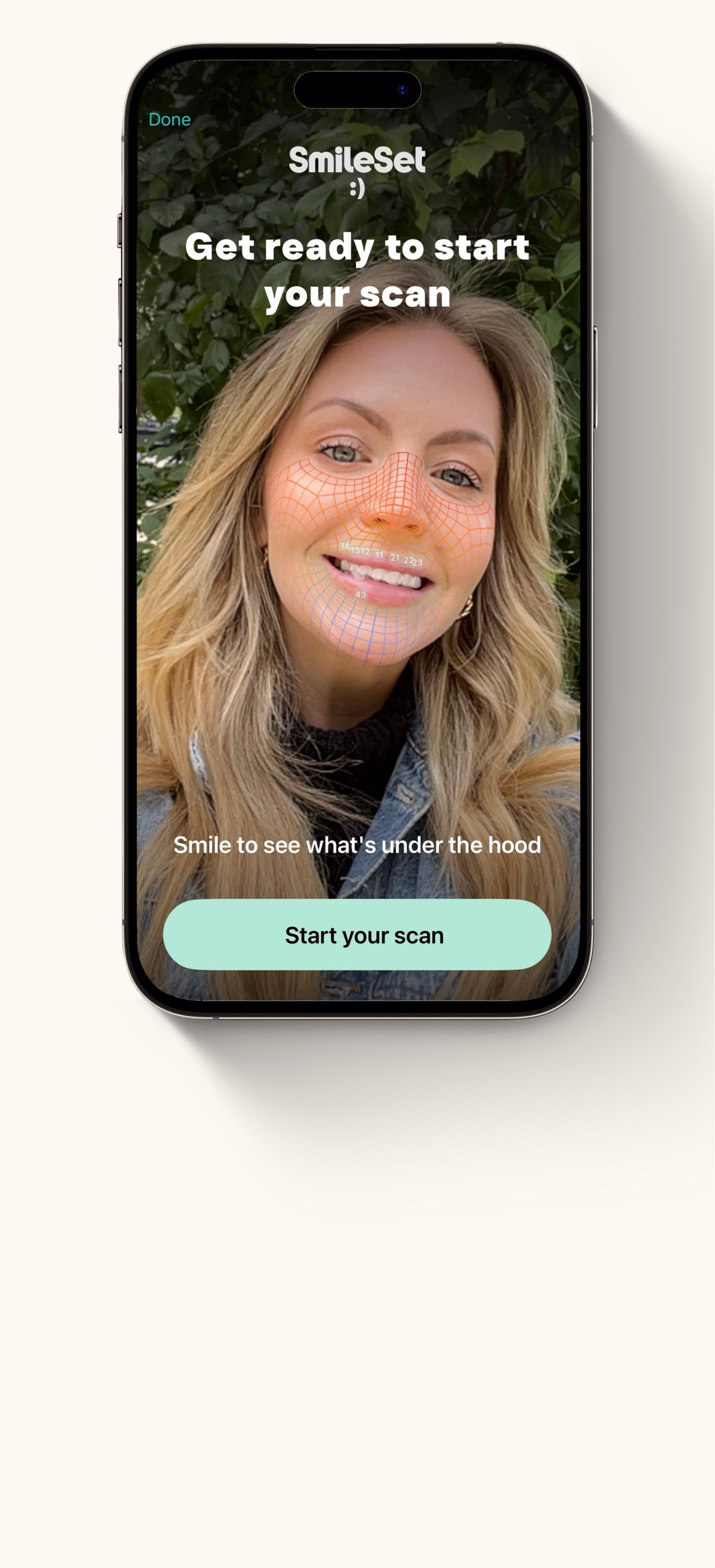 Phone displaying a skincare app with a woman's face on the screen against a white background