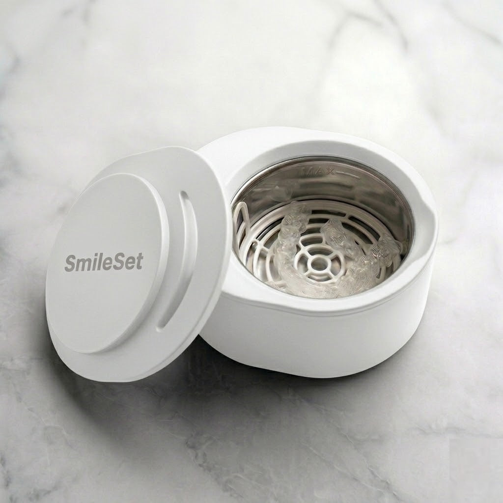 White SmileSet rechargeable ultrasonic cleaner open to show the basket