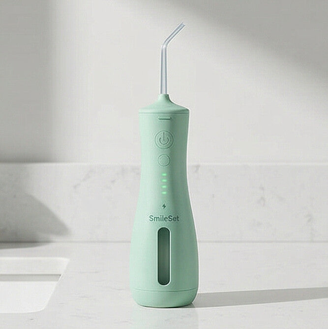Mint SmileSet water flosser on a bathroom counter