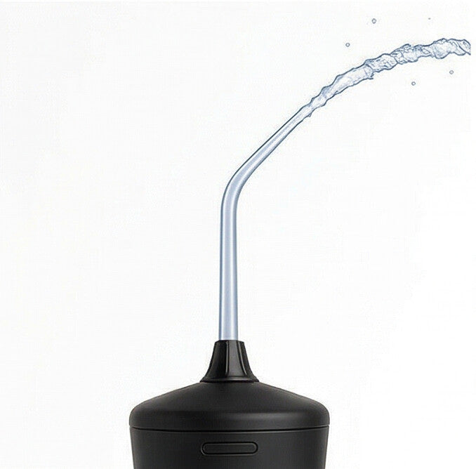Water flosser tip spraying a stream of water
