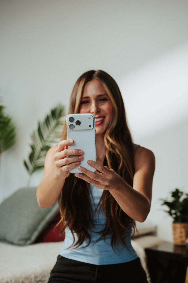 A woman checking the SmileSet app