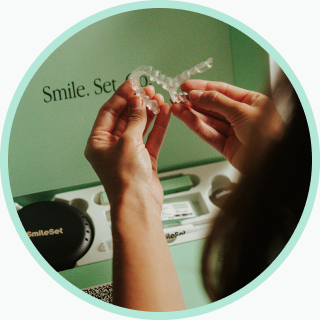 Holding a set of SmileSet aligners