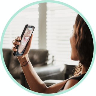 Woman taking a smile photo with her phone