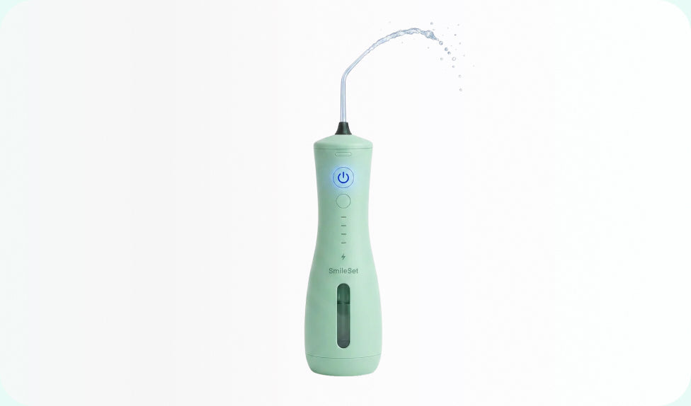 Mint SmileSet Handheld Water Flosser spraying water