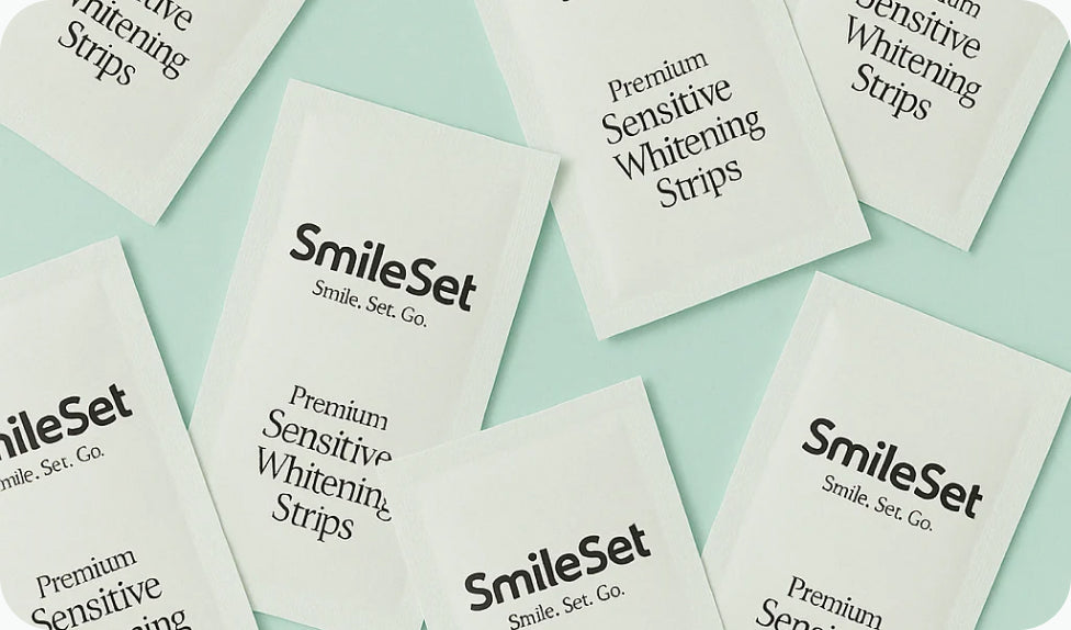 SmileSet Premium Sensitive Whitening Strips packets on mint